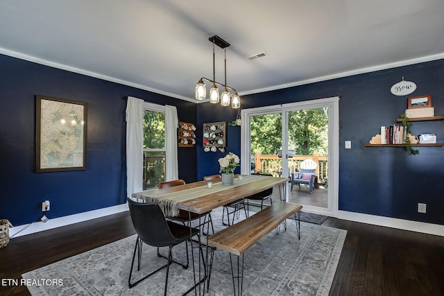 dining space featuring dark hardwood / wood-style flooring and a wealth of natural light