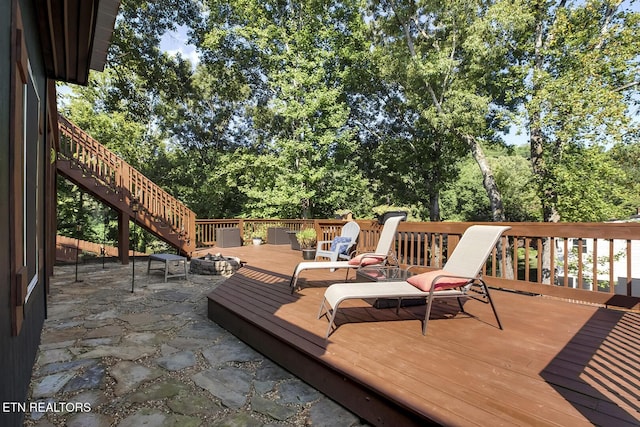 wooden deck with an outdoor fire pit