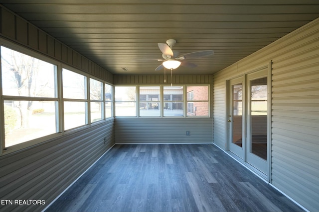 unfurnished sunroom featuring a ceiling fan