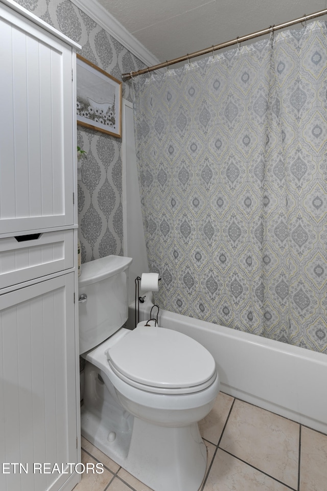 bathroom featuring ornamental molding, tile patterned floors, and toilet