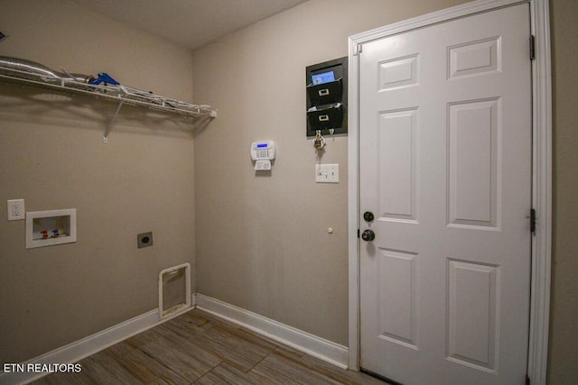 laundry room with hookup for a washing machine, dark hardwood / wood-style floors, and hookup for an electric dryer