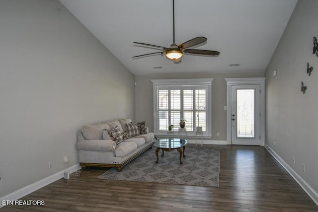 unfurnished living room with vaulted ceiling, dark wood-type flooring, and ceiling fan