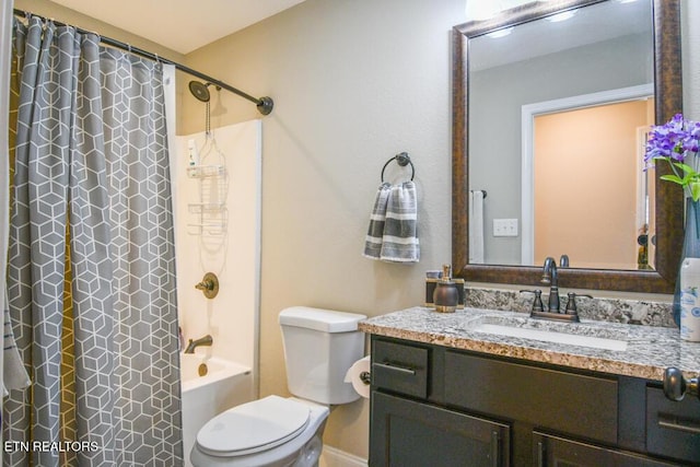 full bathroom featuring vanity, shower / bath combination with curtain, and toilet