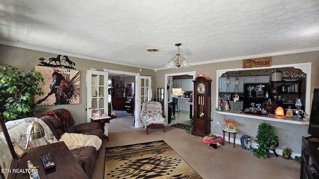 living room featuring french doors, crown molding, a chandelier, a textured ceiling, and carpet flooring