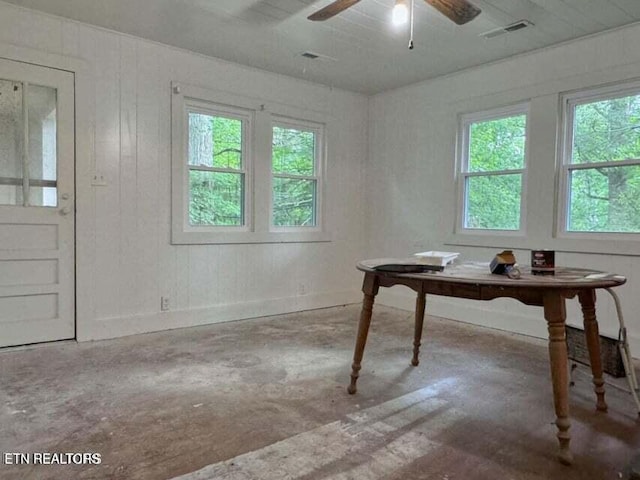 office space with concrete floors and ceiling fan