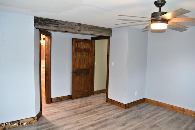 spare room featuring ceiling fan and light wood-type flooring