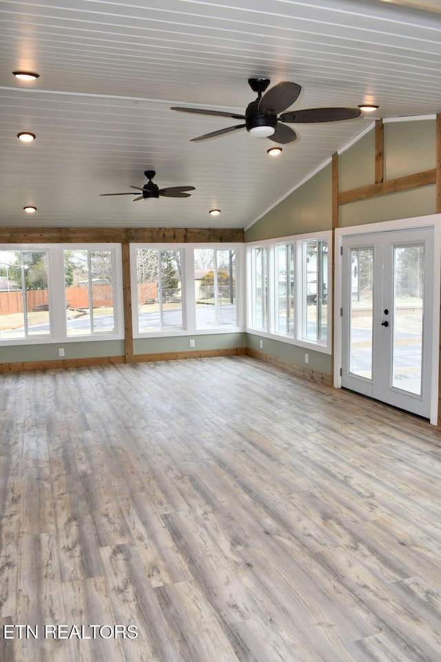 unfurnished sunroom with vaulted ceiling and french doors