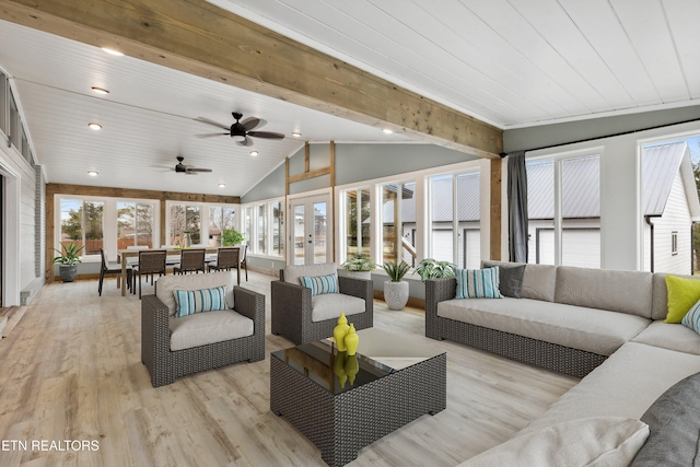 sunroom with french doors, lofted ceiling with beams, and wood ceiling