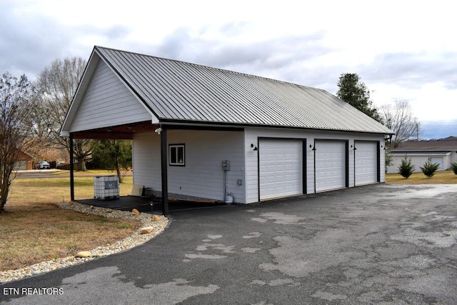 view of property exterior featuring a garage