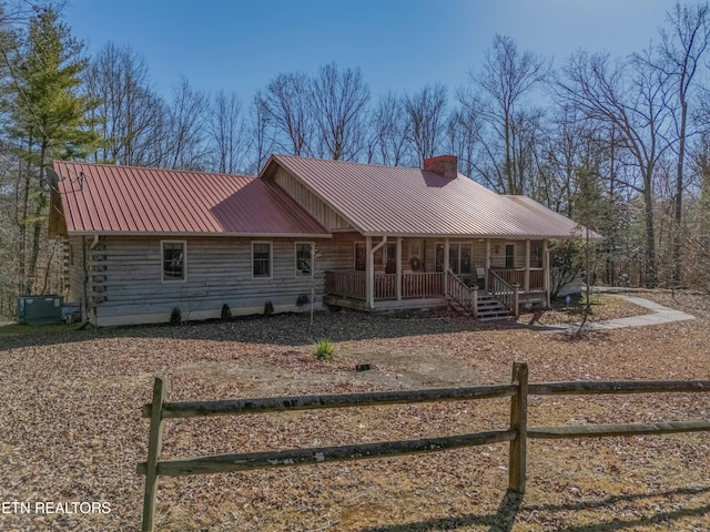 view of front of house with a porch and cooling unit