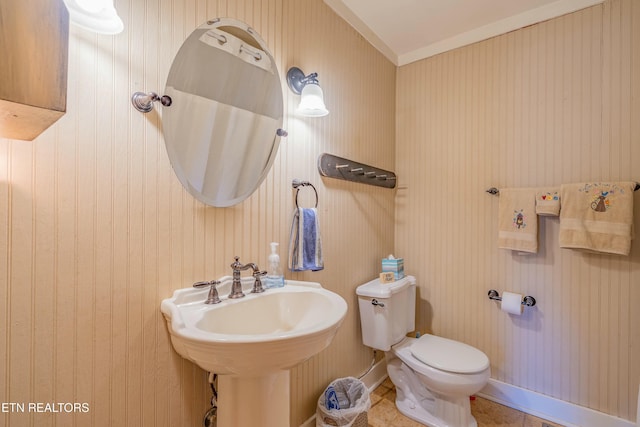 bathroom featuring sink, tile patterned floors, and toilet