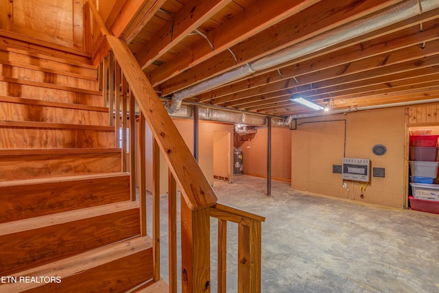 basement with heating unit and electric water heater