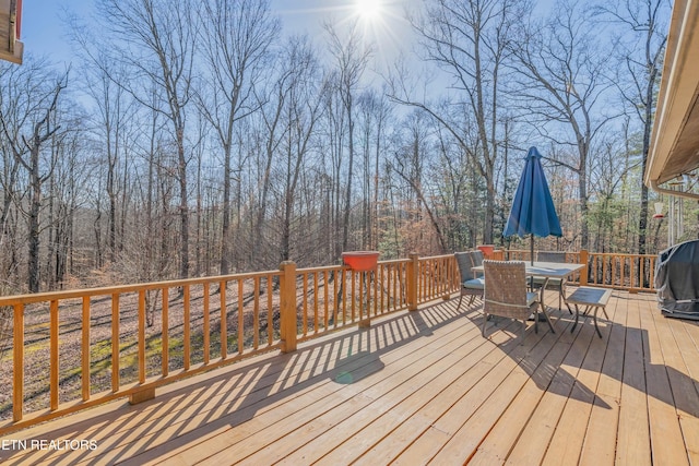 wooden terrace featuring area for grilling