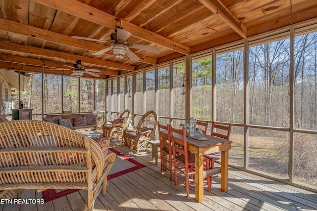 sunroom with wood ceiling, ceiling fan, and beamed ceiling