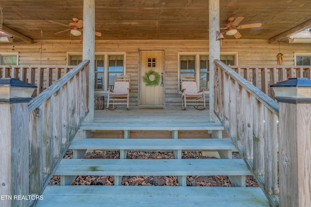 doorway to property with ceiling fan