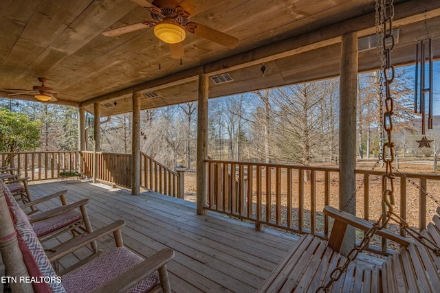 wooden deck with ceiling fan