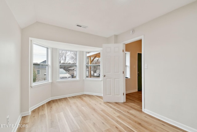 empty room with light hardwood / wood-style floors