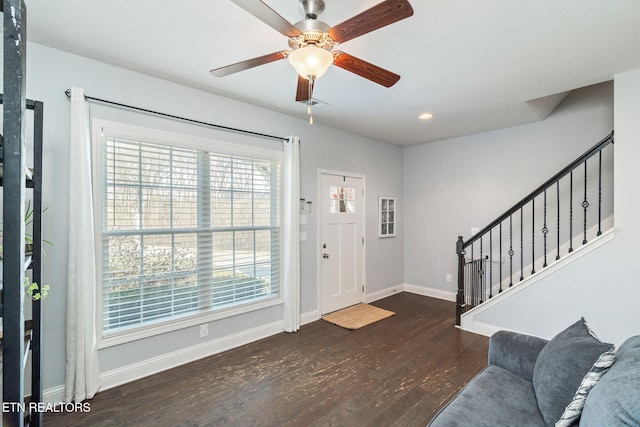 entryway featuring ceiling fan and dark hardwood / wood-style floors