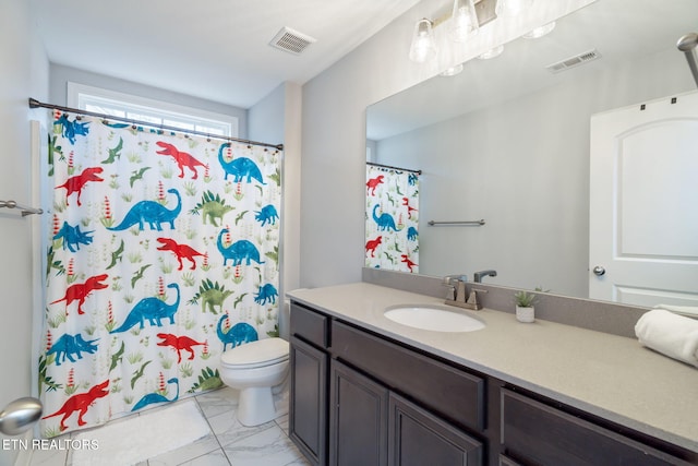 bathroom featuring vanity, toilet, and walk in shower