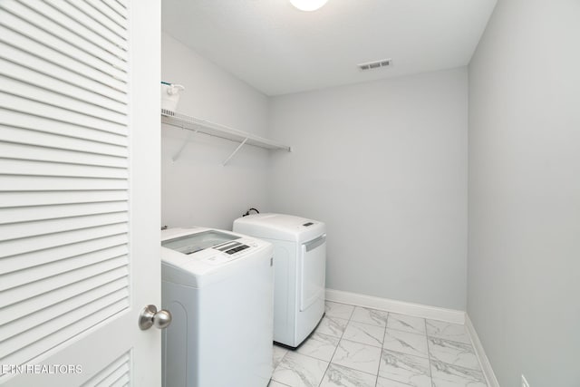 laundry area with washing machine and dryer