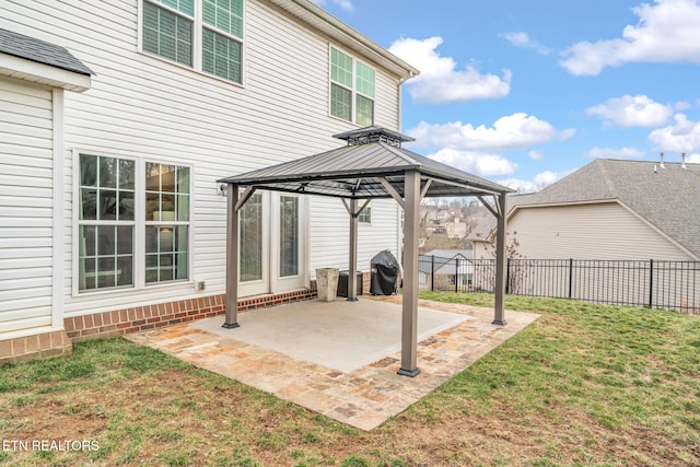 view of patio with area for grilling and a gazebo