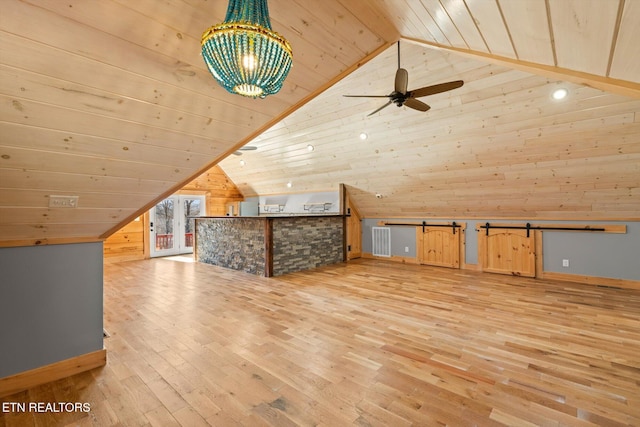 additional living space with ceiling fan, wooden walls, vaulted ceiling, wooden ceiling, and light wood-type flooring