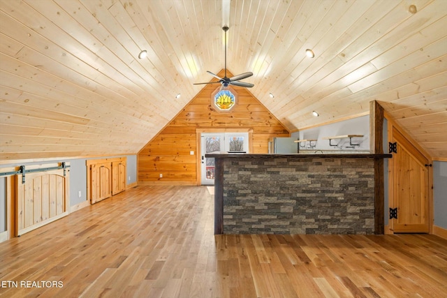 additional living space with hardwood / wood-style flooring, lofted ceiling, wooden ceiling, and ceiling fan