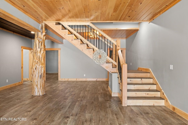 stairs with hardwood / wood-style floors and wood ceiling