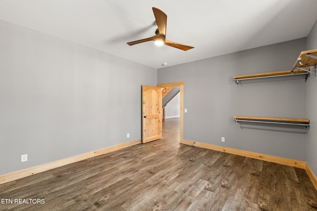 unfurnished bedroom with ceiling fan and hardwood / wood-style floors