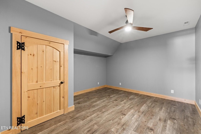 bonus room featuring hardwood / wood-style floors, vaulted ceiling, and ceiling fan