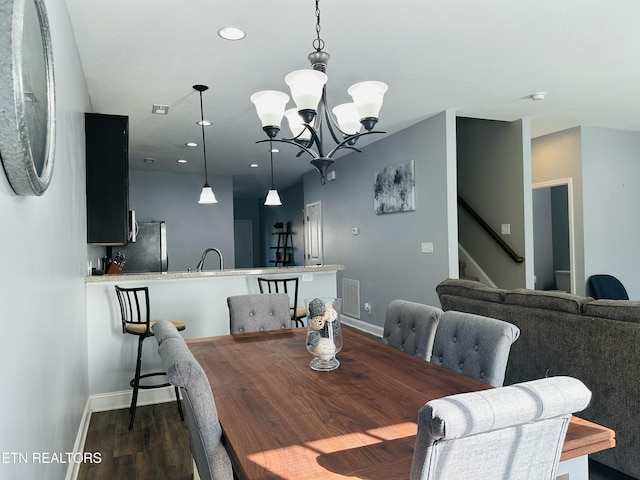 dining area with dark wood-style flooring, recessed lighting, visible vents, baseboards, and stairs