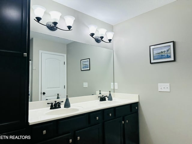 full bathroom with a sink and double vanity