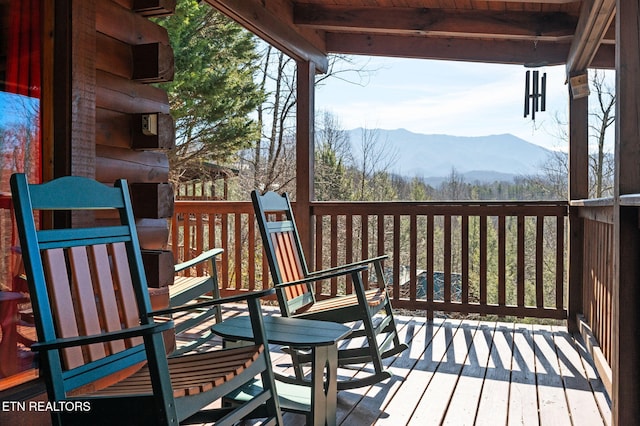 wooden terrace with a mountain view