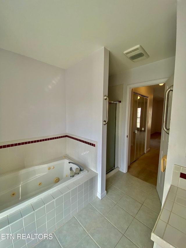 bathroom featuring tile patterned floors and plus walk in shower