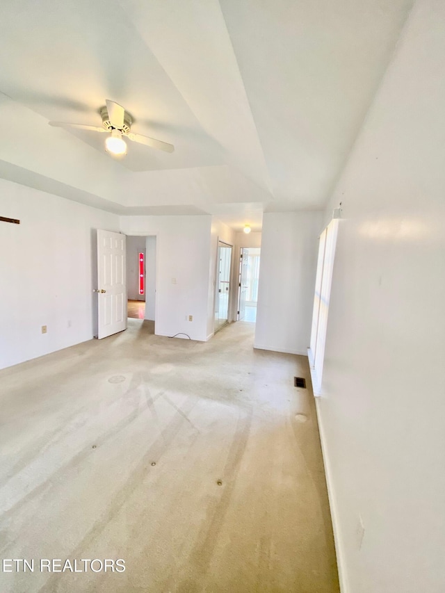 carpeted empty room with ceiling fan