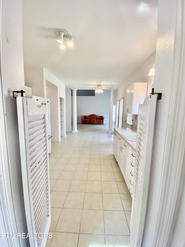 bathroom featuring vanity, tile patterned floors, and decorative columns