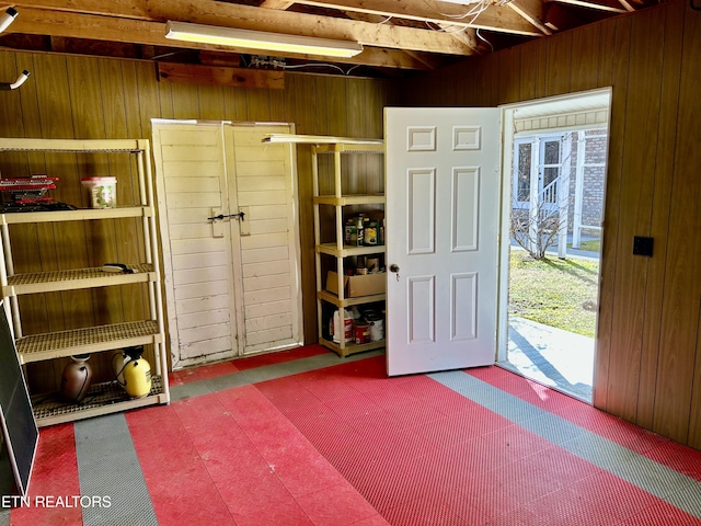 interior space featuring wood walls