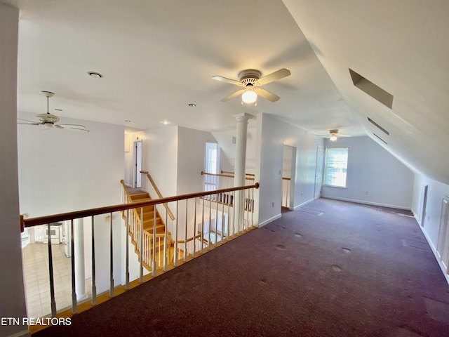 additional living space featuring vaulted ceiling and carpet