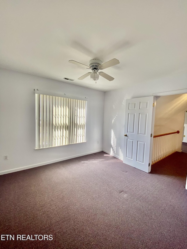 carpeted empty room with ceiling fan