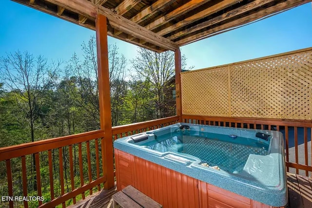 deck featuring a hot tub