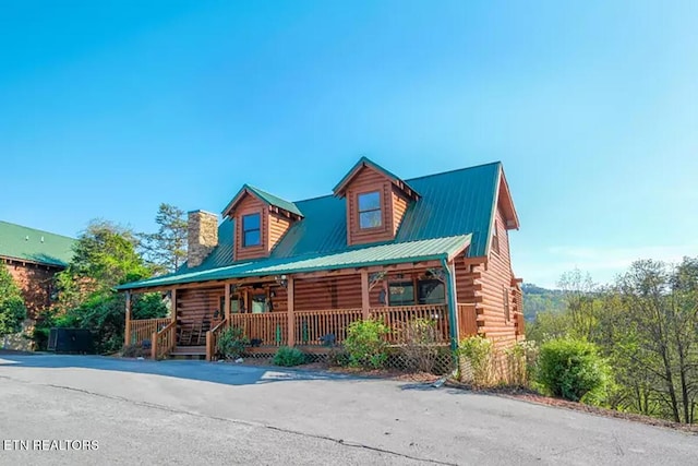 log home with a porch