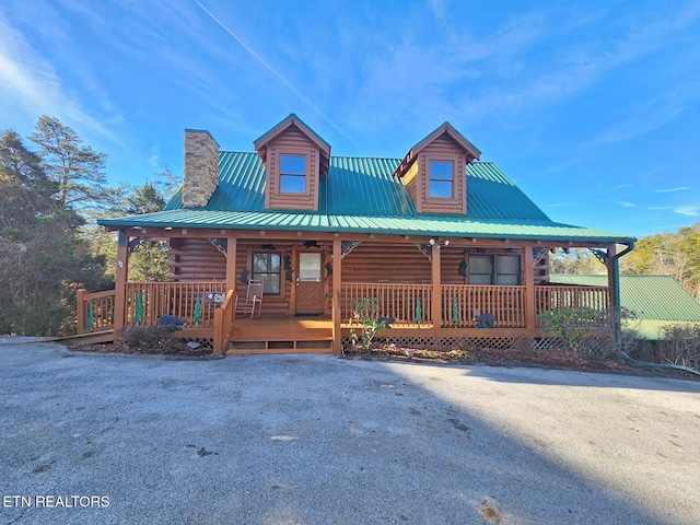 cabin featuring covered porch