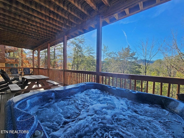 deck featuring a hot tub