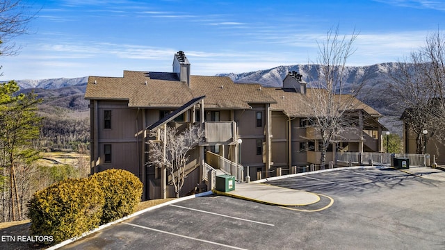 view of building exterior featuring a mountain view