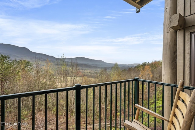 balcony featuring a mountain view