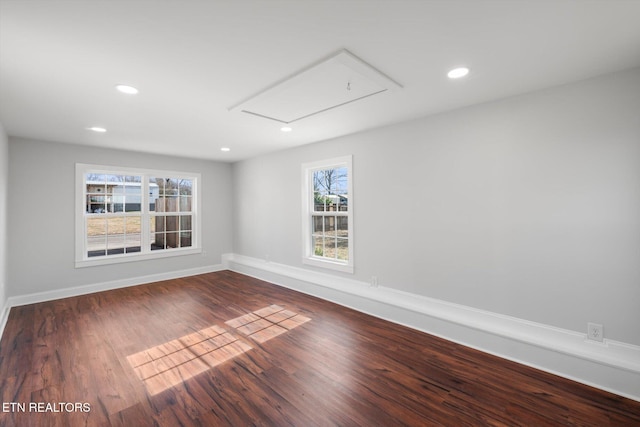 empty room with dark hardwood / wood-style floors