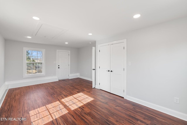 empty room with dark hardwood / wood-style floors