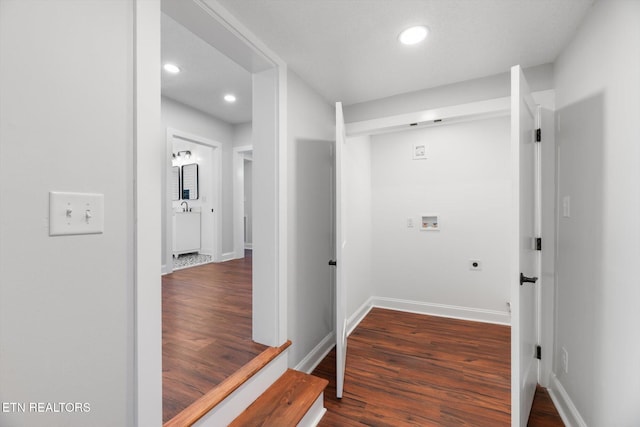 washroom with hookup for a washing machine, hookup for an electric dryer, and dark hardwood / wood-style flooring