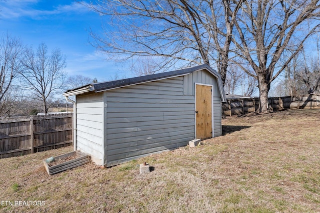 view of outdoor structure with a lawn