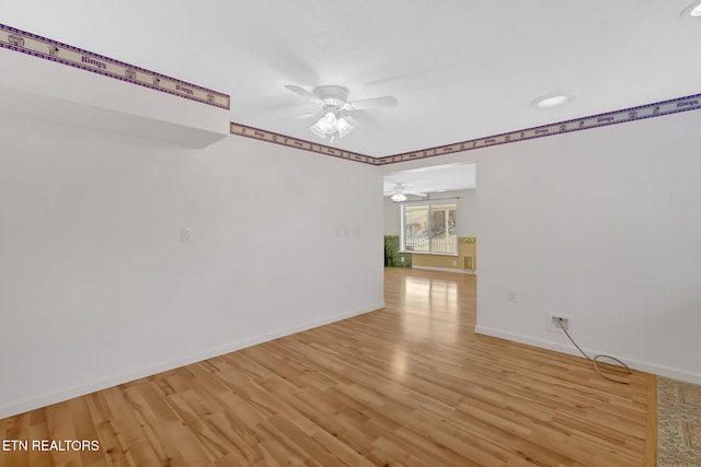 unfurnished room featuring light hardwood / wood-style flooring and ceiling fan